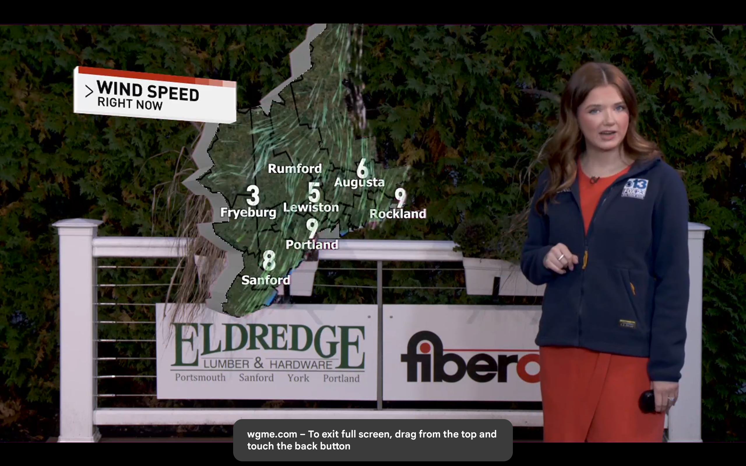 Eldredge sign behind WGME 13 weather broadcast