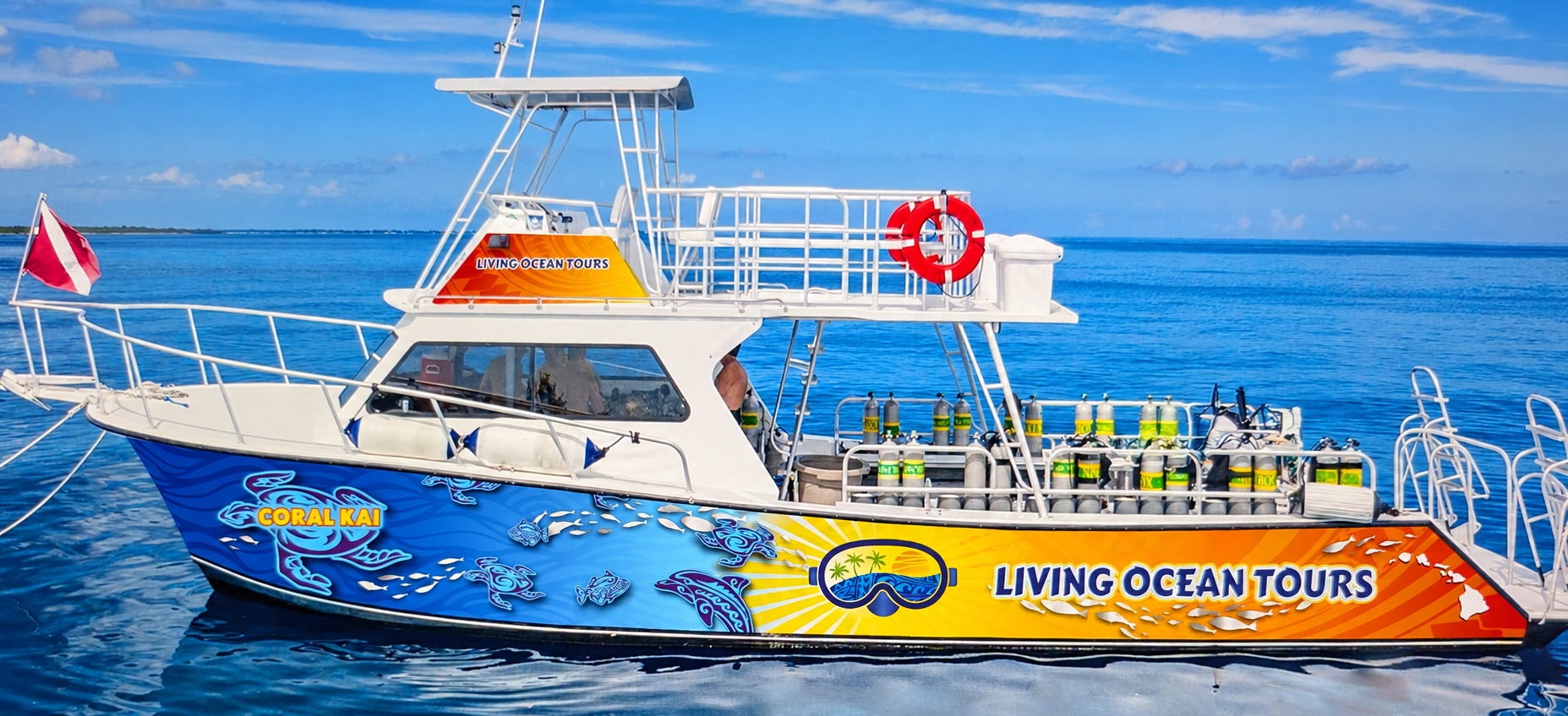 Living Ocean Tours dive boat Coral Kai with full hull wrap