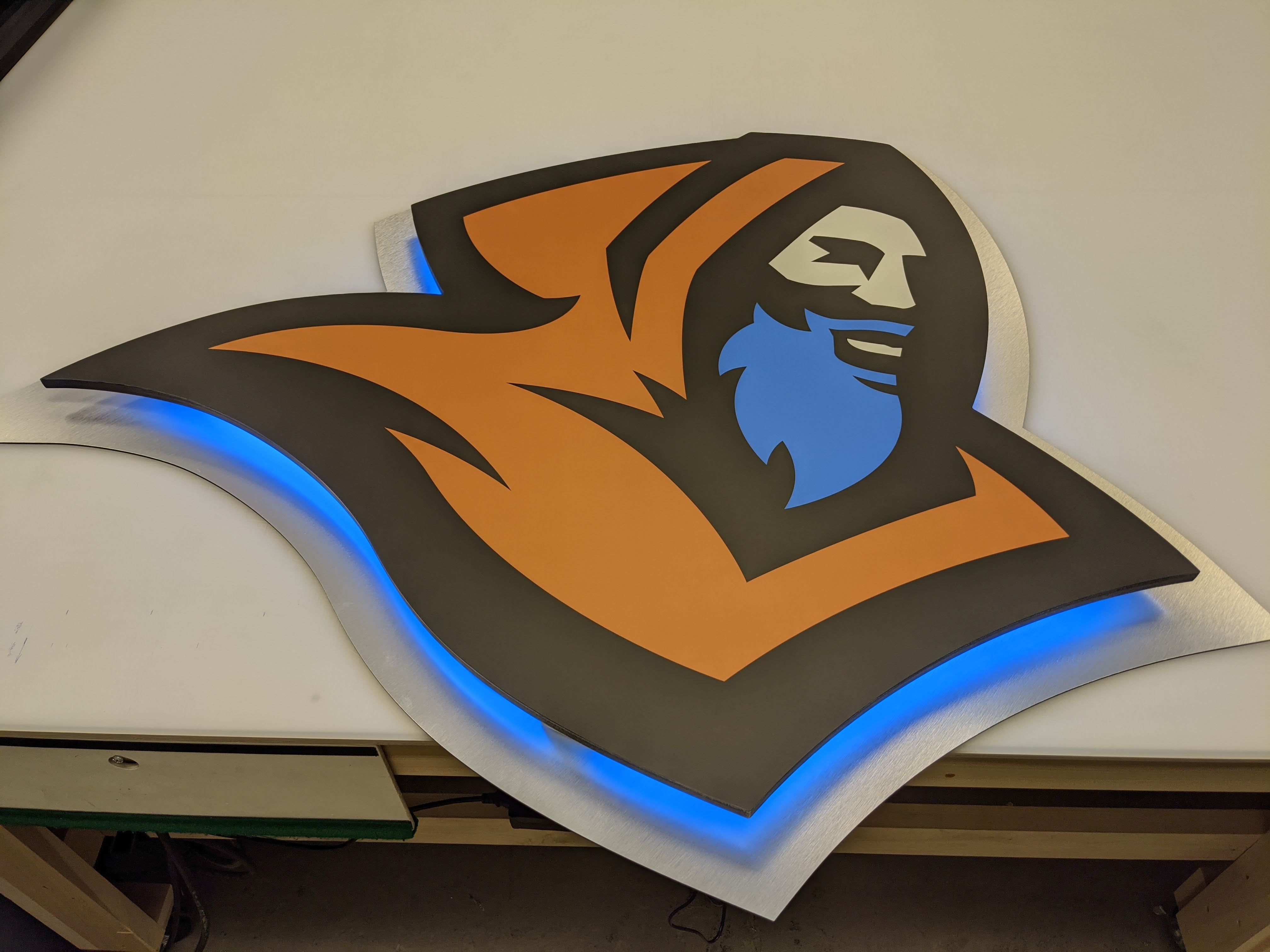 Monks logo sign with blue LED edge light