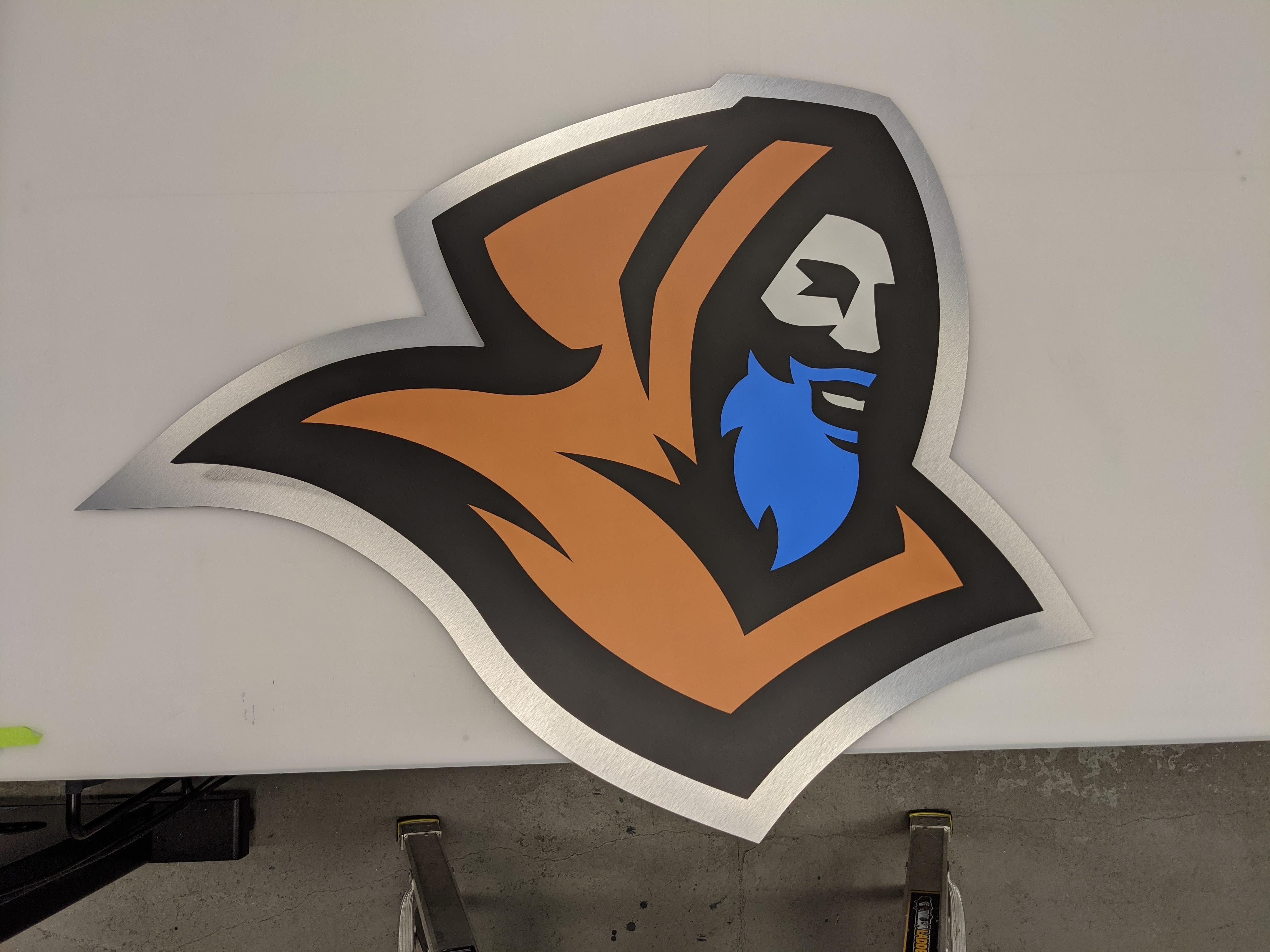 Monks logo on brushed aluminum