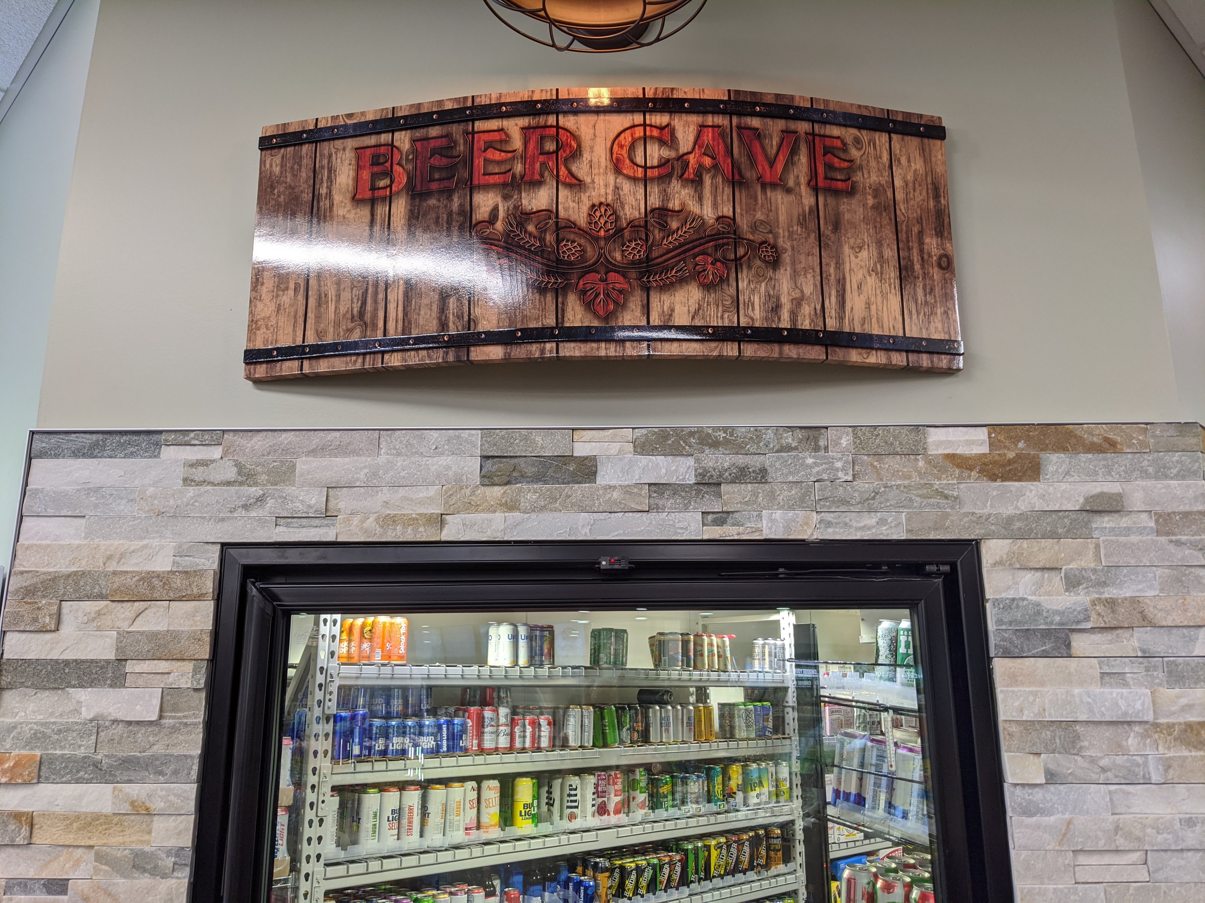 Curved barrel-style Beer Cave sign