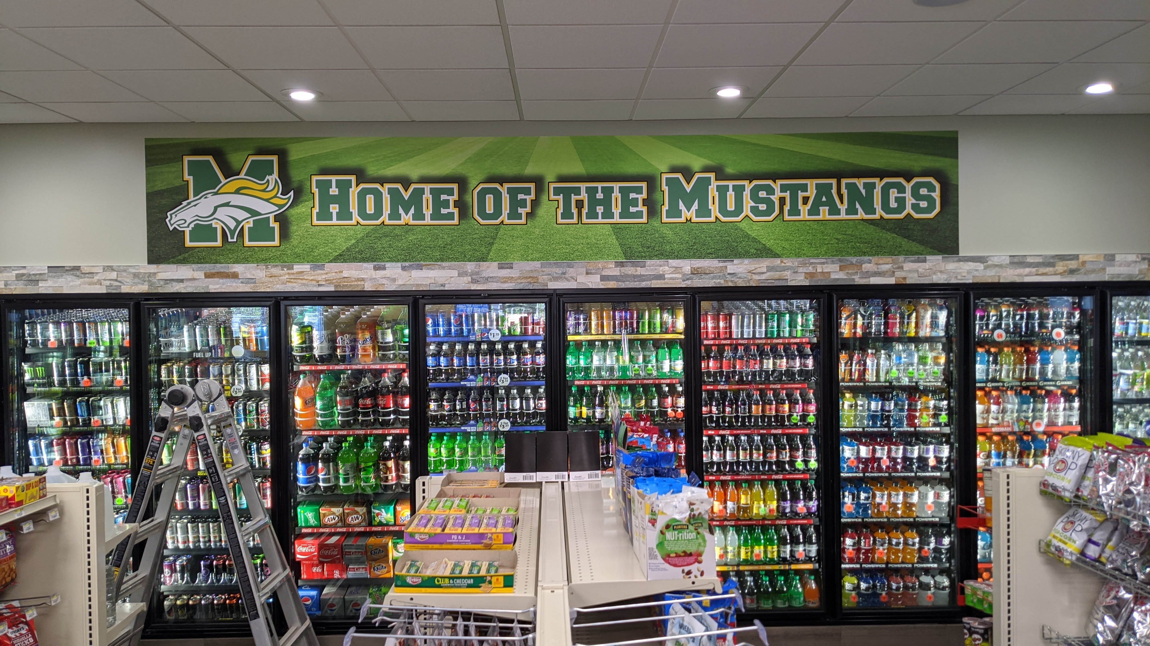 Home of the Mustangs mural above coolers